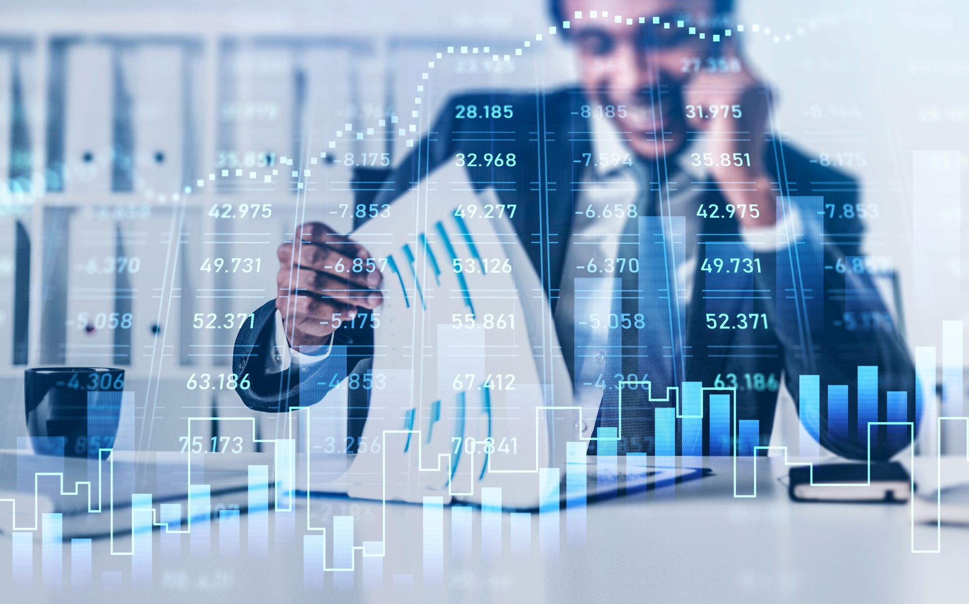 Businessman analyzing financial data charts and graphs on computer, depicting stock market trends and corporate growth strategies.